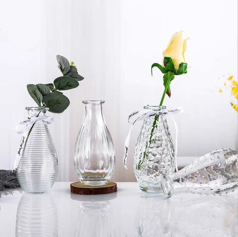 Home Decoration Tabletop Mini Clear Bottle Shape Glass Vase with Beautiful Emboss