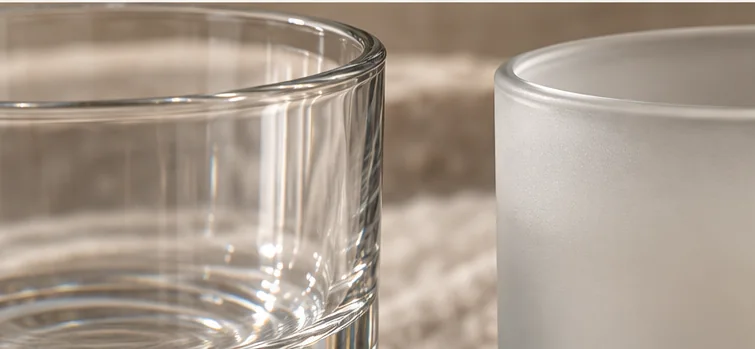 Close-up of clear and frosted glass vessel rims showing surface and edge details